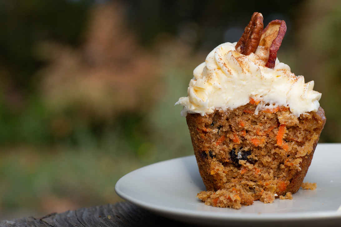 Carrot Cake Cupcake with Cream Cheese Icing with an Autumn Background